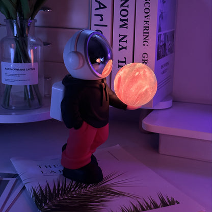 Holding the dreamy starry sky (black top + red pants) Creative Astronaut Bluetooth Speaker with 3D Starry Sky Lighting, Portable Wireless Moon Lamp Speaker - Perfect Gift for Space Enthusiasts